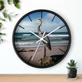 Load image into Gallery viewer, A detailed view of the wooden frame on the heron wall clock, highlighting the use of handmade resin on wood.