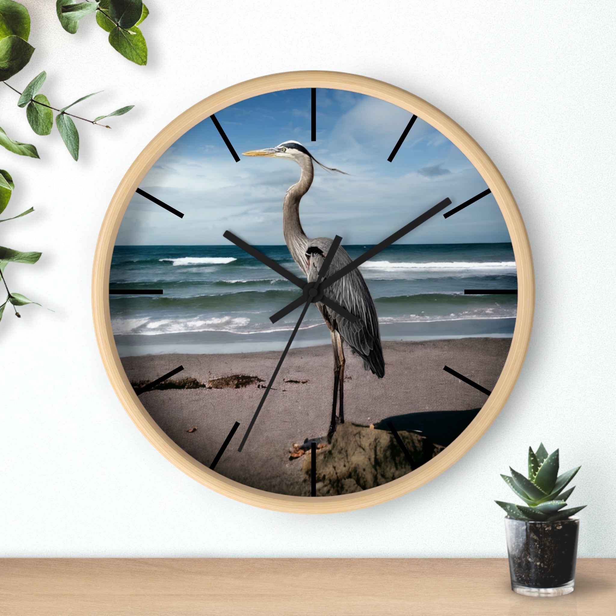Close-up view of a wall clock with a heron design, showcasing the handmade resin on wood details that enhance its unique character.