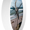 Load image into Gallery viewer, The serene ocean backdrop on the heron wall clock, crafted with handmade resin on wood, perfect for any room.