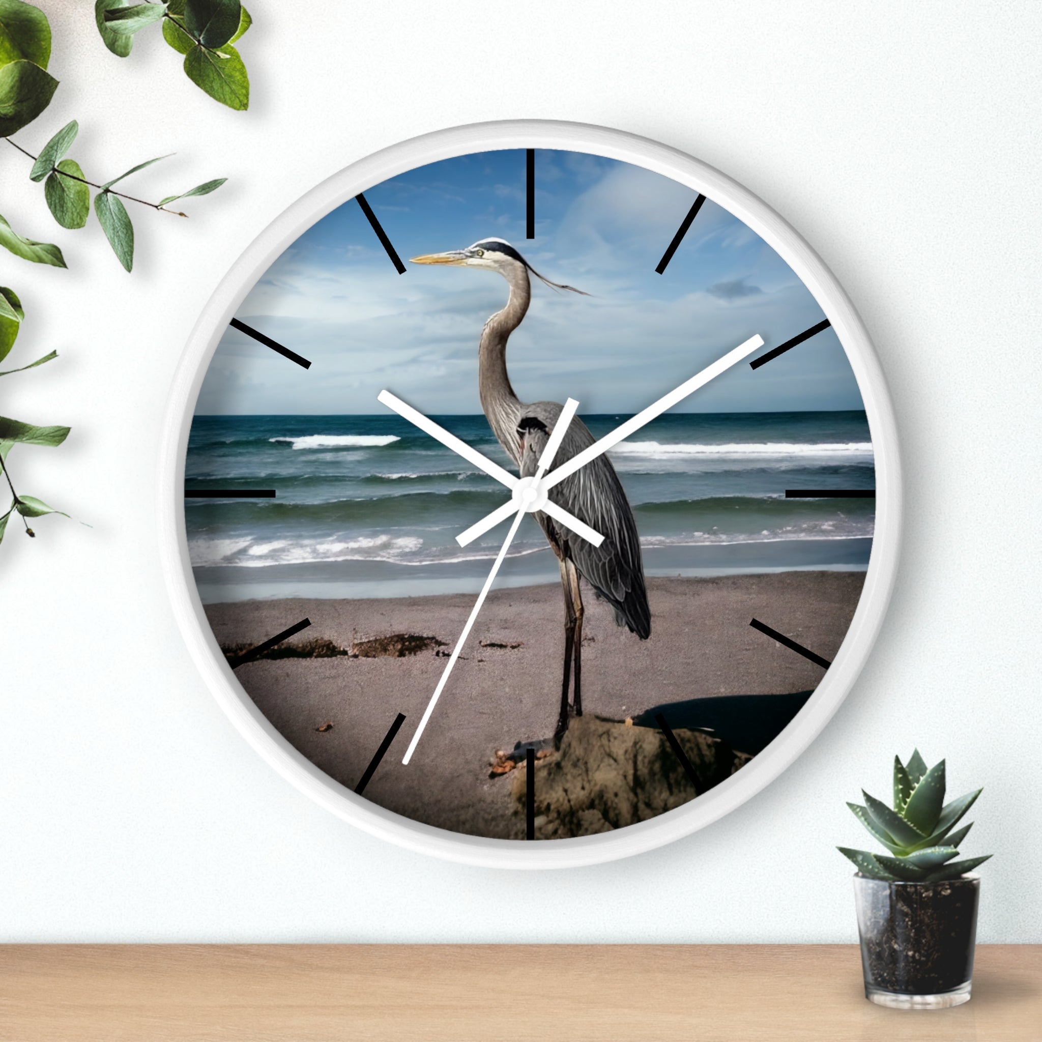 Artistic shot of the ocean backdrop wall clock showing a heron in flight, crafted with handmade resin on wood for a personalized decor vibe.