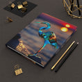 Load image into Gallery viewer, Handmade resin on wood design featuring a blue heron silhouetted against a stunning sunset, perfect for a hardcover journal cover.