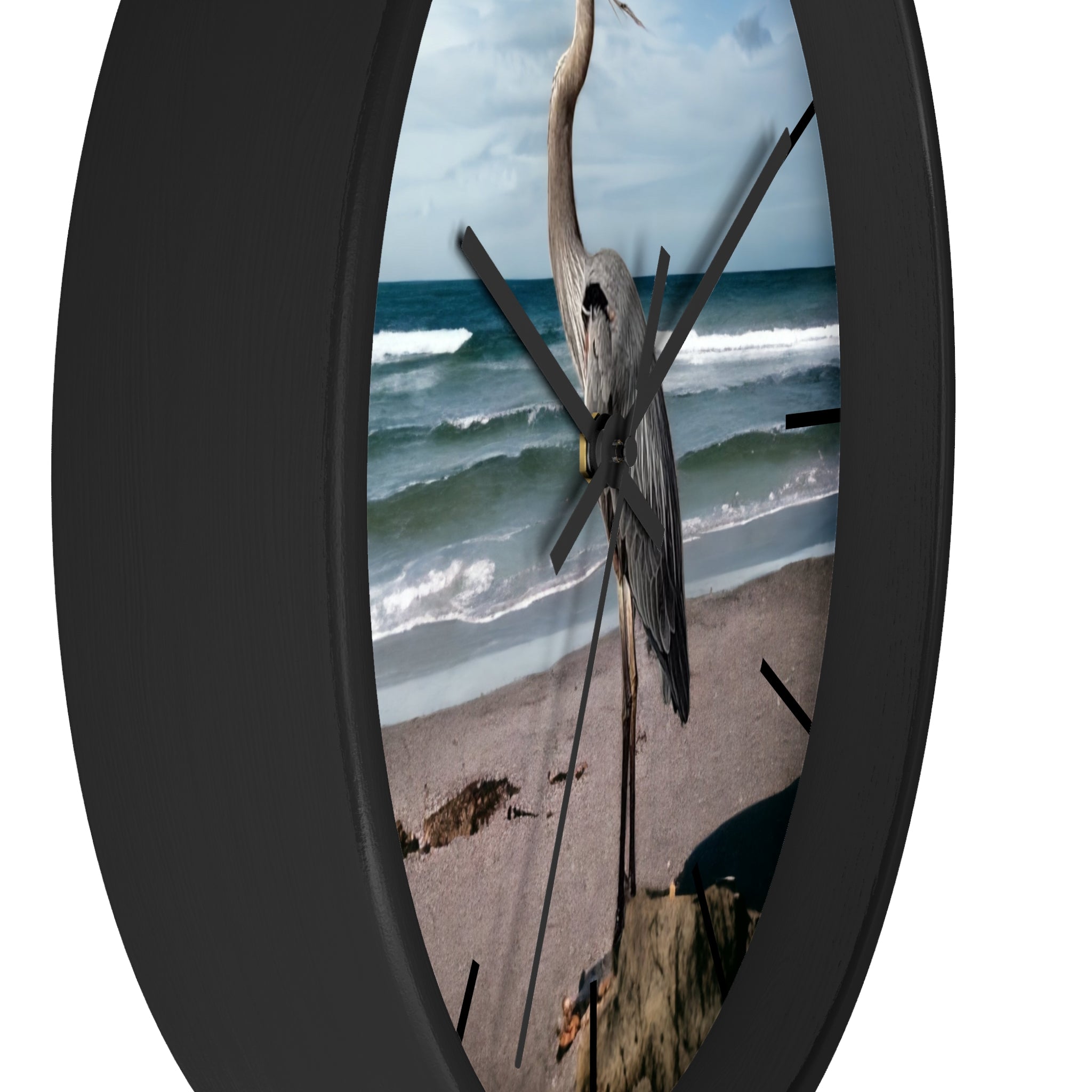 A beautifully framed wall clock featuring a heron by the sea, designed with handmade resin on wood for durability and style.