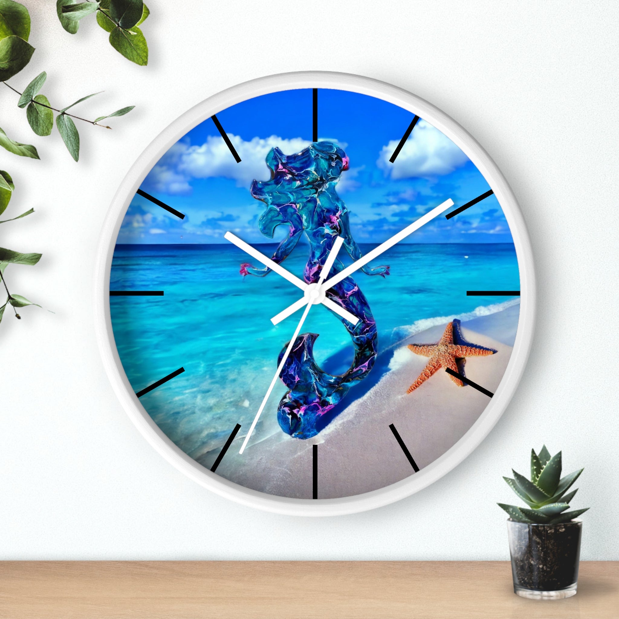 A round wall clock featuring beautiful artwork of a handmade resin mermaid on wood, set against a tropical beach and adorned with a starfish.