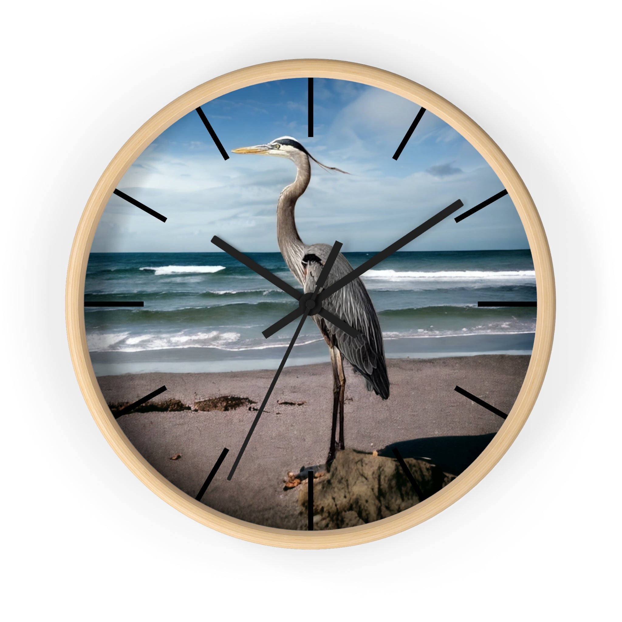 A stunning wall clock featuring a beautiful heron against an ocean backdrop, showcasing handmade resin on wood for a unique coastal decor accent.