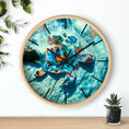 Load image into Gallery viewer, Close-up of the round wall clock face displaying intricate handmade resin artwork of a sea turtle, mounted on a stylish wood frame.