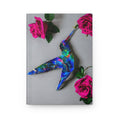 Load image into Gallery viewer, Gorgeous blue hummingbird artwork made from handmade resin on wood, beautifully complemented by pink roses, featured on a hardcover journal.