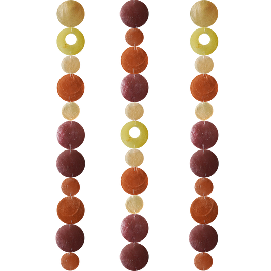 Capiz Shell Strands 72 Inch Long Flame featuring vibrant spice, brown, orange, and yellow shades in a decorative arrangement. Perfect for indoor or outdoor spaces, these handmade strands add shimmer and sound to your design.