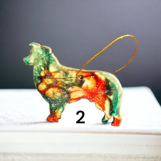 Handmade resin on wood Australian Shepherd ornament showcasing a mix of green and red colors, ideal for festive holiday decorations.