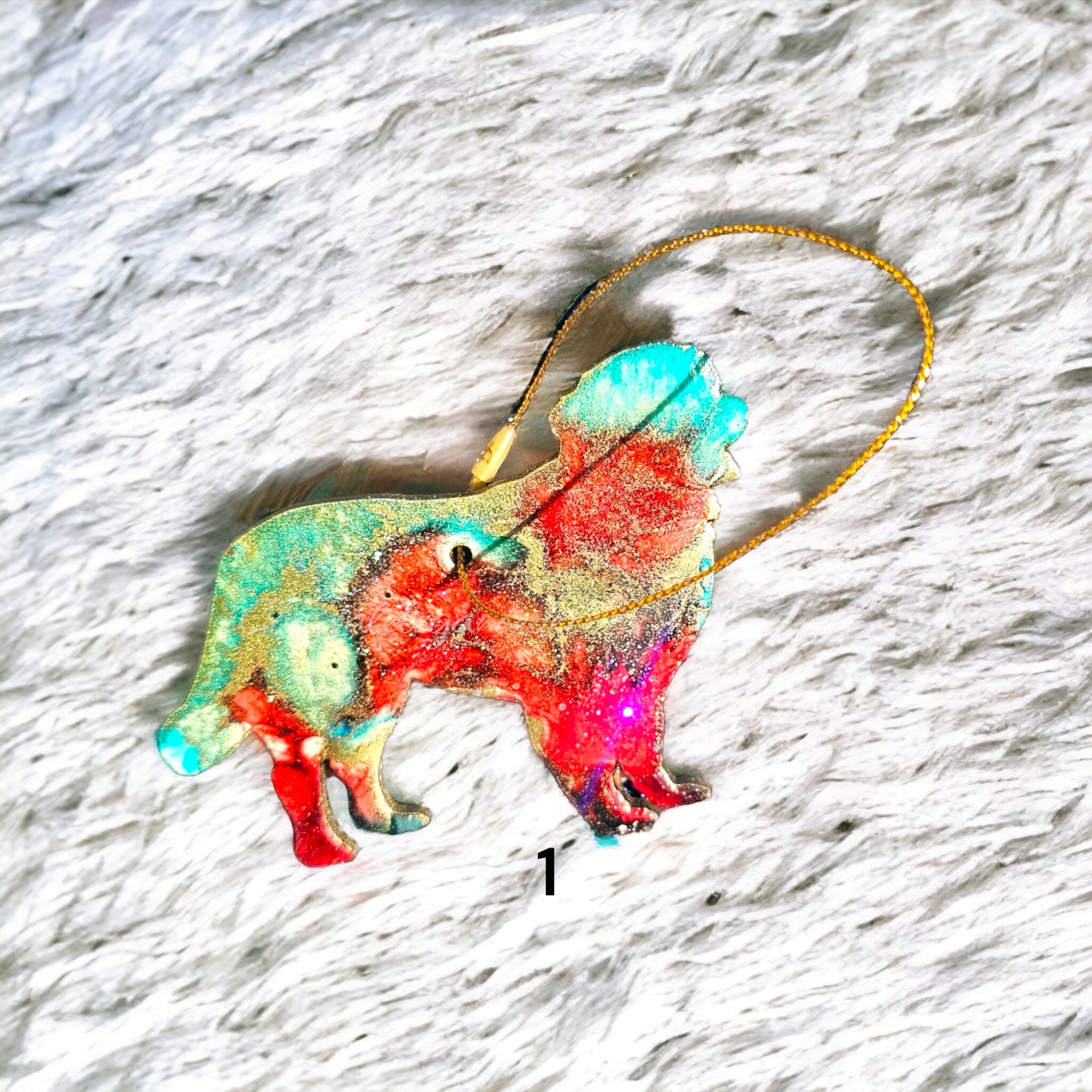 Colorful handmade resin Bernese Mountain Dog Christmas ornament in red and turquoise, showcasing a glittery finish, ideal for holiday ornament collections.