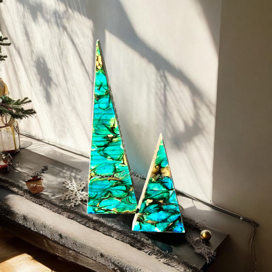 Beachy Blue Contemporary Triangle Christmas Trees beautifully arranged on a decorative surface, highlighting their striking colors and artful craftsmanship.