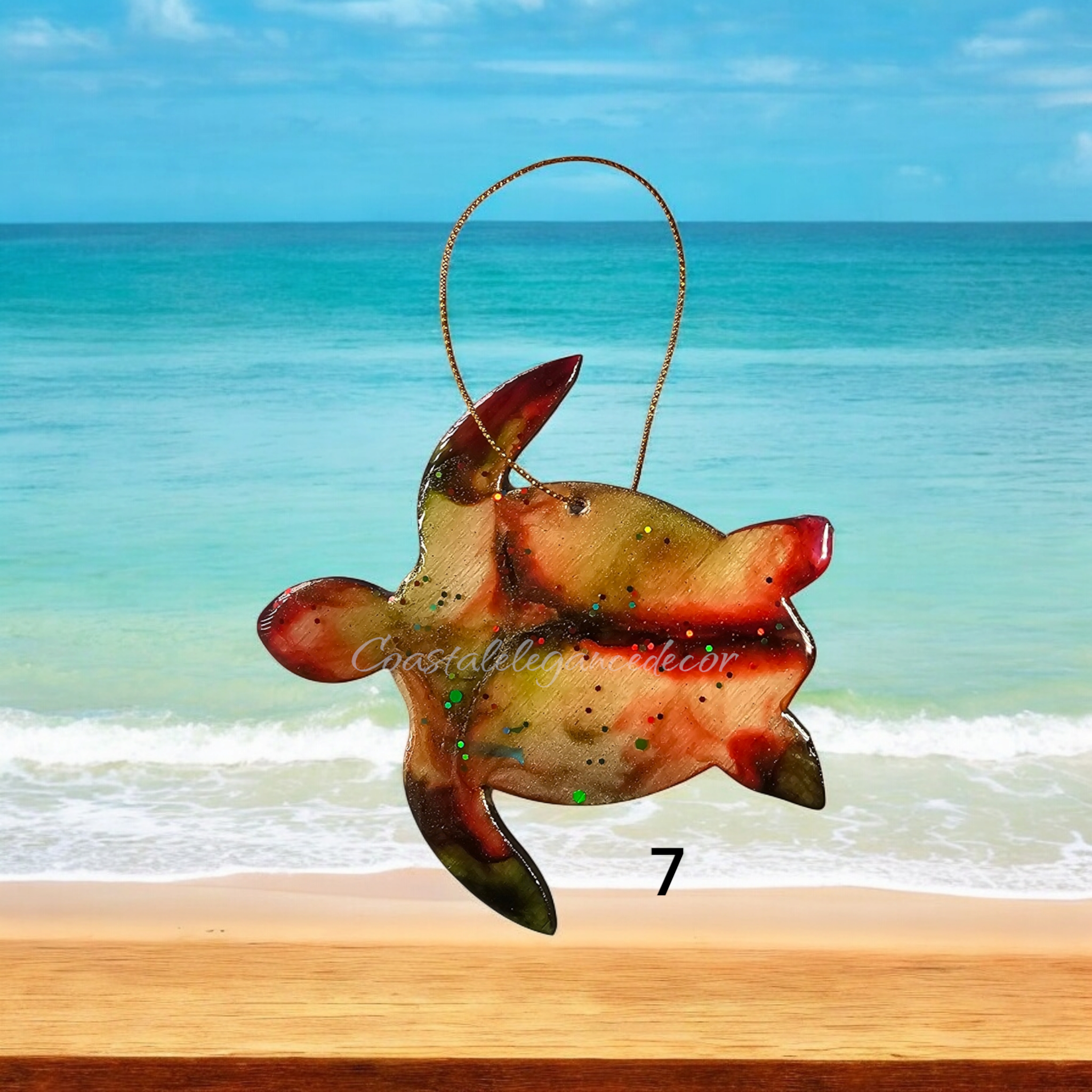 Beautifully crafted sea turtle ornament made of handmade resin on wood, featuring a glittered back for a festive touch.