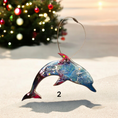 Charger l'image dans la visionneuse de la galerie, Close-up view of a colorful ocean-themed dolphin ornament, showcasing the unique handmade resin on wood design with sparkly details, ideal for enhancing your festive tree.