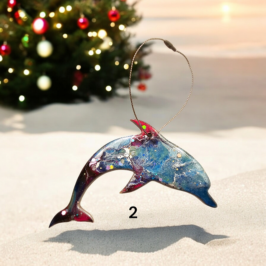 Close-up view of a colorful ocean-themed dolphin ornament, showcasing the unique handmade resin on wood design with sparkly details, ideal for enhancing your festive tree.