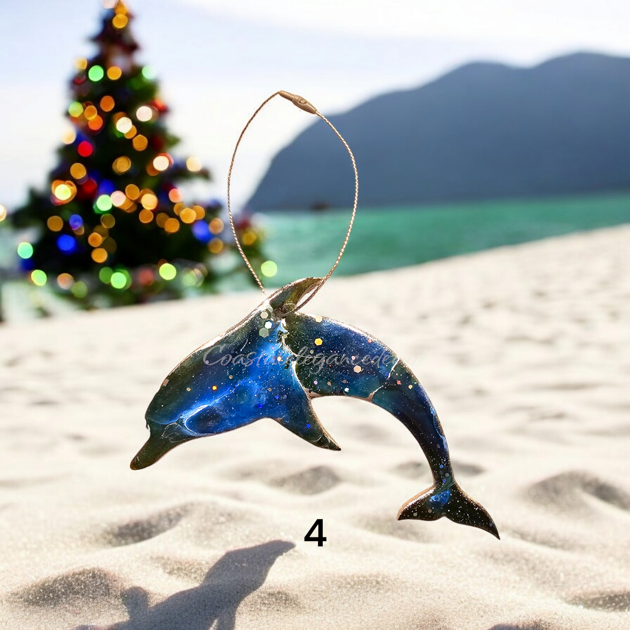 Brightly pigmented dolphin Christmas ornament, crafted from handmade resin on wood, ideal for ocean lovers.