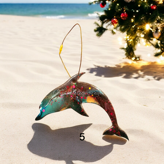 Brightly colored dolphin Christmas tree ornament, handmade resin on wood, featuring metallic accents and glitter, perfect for a beach-themed holiday decor.