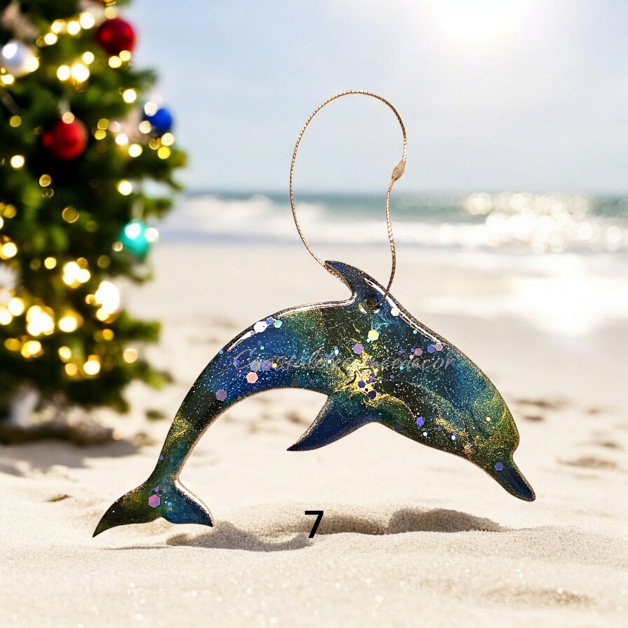 Handmade resin on wood dolphin ornament, beautifully designed for a tropical-themed holiday celebration.