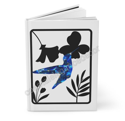 Cover of a Blue Hummingbird with Black Floral Background Hardcover Journal featuring an original art design of a blue hummingbird surrounded by black floral accents.
