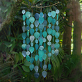 Load image into Gallery viewer, Decorative hanging mobile with teal and silver teardrop shapes against a green foliage background