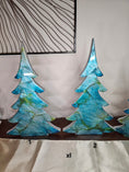 Load image into Gallery viewer, Beautiful handmade blue green and silver resin Christmas tree standing tall as a holiday mantelpiece, perfect for festive décor with sparkling glitter accents.