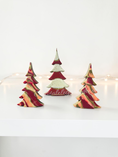 Charger l'image dans la visionneuse de la galerie, A set of handcrafted solid pine Christmas trees decorated with hand-poured swirling cranberry, fuchsia, and ivory fluid resin. The tall center tree features a diagonal band of crushed glass geode texturing with gold and glitter accents