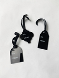 Load image into Gallery viewer, Three black gift tags with black ribbon loops and white 'TO:' and 'FROM:' text, arranged on a plain white background.