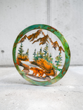 Load image into Gallery viewer, Handmade 15.5-inch resin on wood wall art side view featuring a bear at the water with fir trees and mountains, metallic accents, rustic nature-inspired décor.