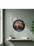Load image into Gallery viewer, 11.5 inch round black acrylic wall clock with a hand-painted metallic bronze-to-copper gradient. The design features a black silhouette of a black bear, fir trees, and a mountain range with copper numerals and hands.