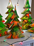 Load image into Gallery viewer, Handmade Green and Red Resin Christmas Trees with Branches Holiday Mantelpiece displayed in Medium size, showcasing unique patterns and swirls, ideal for adding holiday cheer.