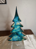 Load image into Gallery viewer, Close-up of Handmade Teal and Gold Christmas Trees with Branches Holiday Shelf Sitter, detailed view showcasing the artistic wood and resin blend.