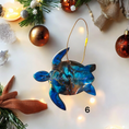 Charger l'image dans la visionneuse de la galerie, Colorful sparkly sea turtles Christmas ornament handmade from resin on wood, showcasing vibrant colors and metallic accents.