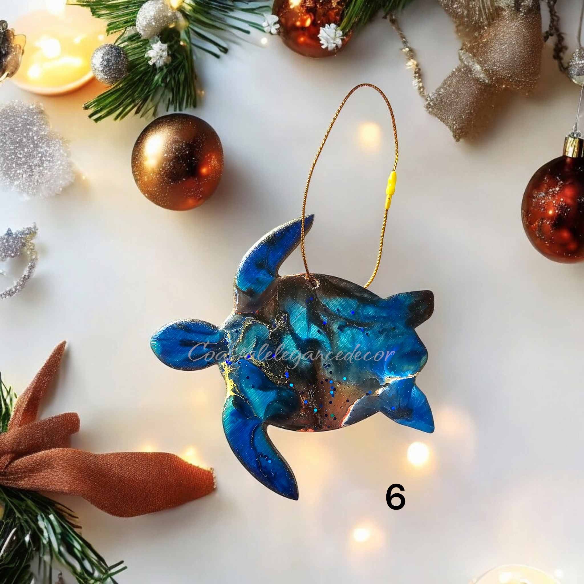 Colorful sparkly sea turtles Christmas ornament handmade from resin on wood, showcasing vibrant colors and metallic accents.
