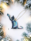 Charger l'image dans la visionneuse de la galerie, Playful cat and butterfly colorful resin handmade Christmas ornament on white background with Christmas lights