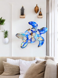 Load image into Gallery viewer, Stylish handmade sea turtle wall decoration featuring lavender blues and brown, created by Coastal Elegance Decor, perfect for adding a beach-inspired touch to any living space.