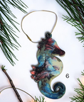 Charger l'image dans la visionneuse de la galerie, Blue handmade seahorse ornament with Christmas boughs and lights