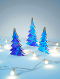 Load image into Gallery viewer, Handmade Sapphire Blue Wood Christmas Trees Holiday Shelf Sitter, showcasing a charming holiday display with gold-painted sides and a signature by the artist.