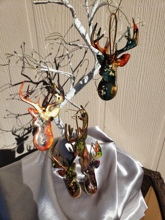 Beautifully crafted handmade resin on wood reindeer head ornament with metallic accents, ideal for holiday decor and gifts.