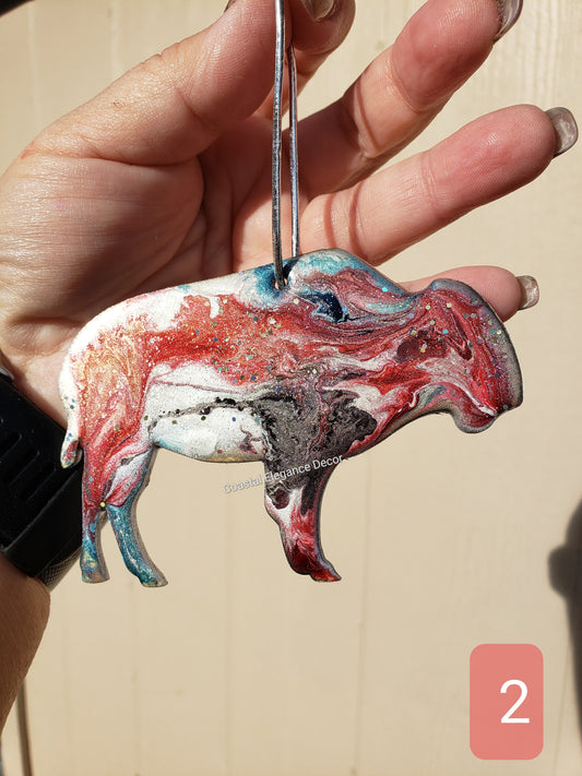 Close up of a buffalo bison ornament handmade resin on wood featuring vibrant colors and unique design, perfect for nature lovers.