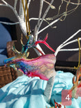 Charger l'image dans la visionneuse de la galerie, Unique handmade resin on wood elk ornament, highlighting the fluid art technique and colorful accents, suitable for holiday decor.