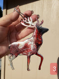 Charger l'image dans la visionneuse de la galerie, Beautifully crafted handmade resin on wood reindeer decoration, ideal gift for the holiday season with vibrant resin overlay.