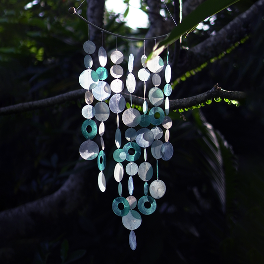Capiz Shell Chime Inverted Arch Wind Chimes Decoration Blue - Beautiful capiz shell wind chime with a blend of blue and turquoise elements, elegantly hanging from a natural wood arch, creating a serene atmosphere.