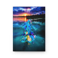 Load image into Gallery viewer, Artistic view of a hardcover journal featuring a handmade resin on wood mermaid abstract, showcasing stunning colors of a sunset over the water.
