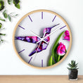 Load image into Gallery viewer, Purple Print Art wall clock featuring a handmade resin design of a hummingbird on wood, beautifully complementing any room with its vibrant tulip flower backdrop.
