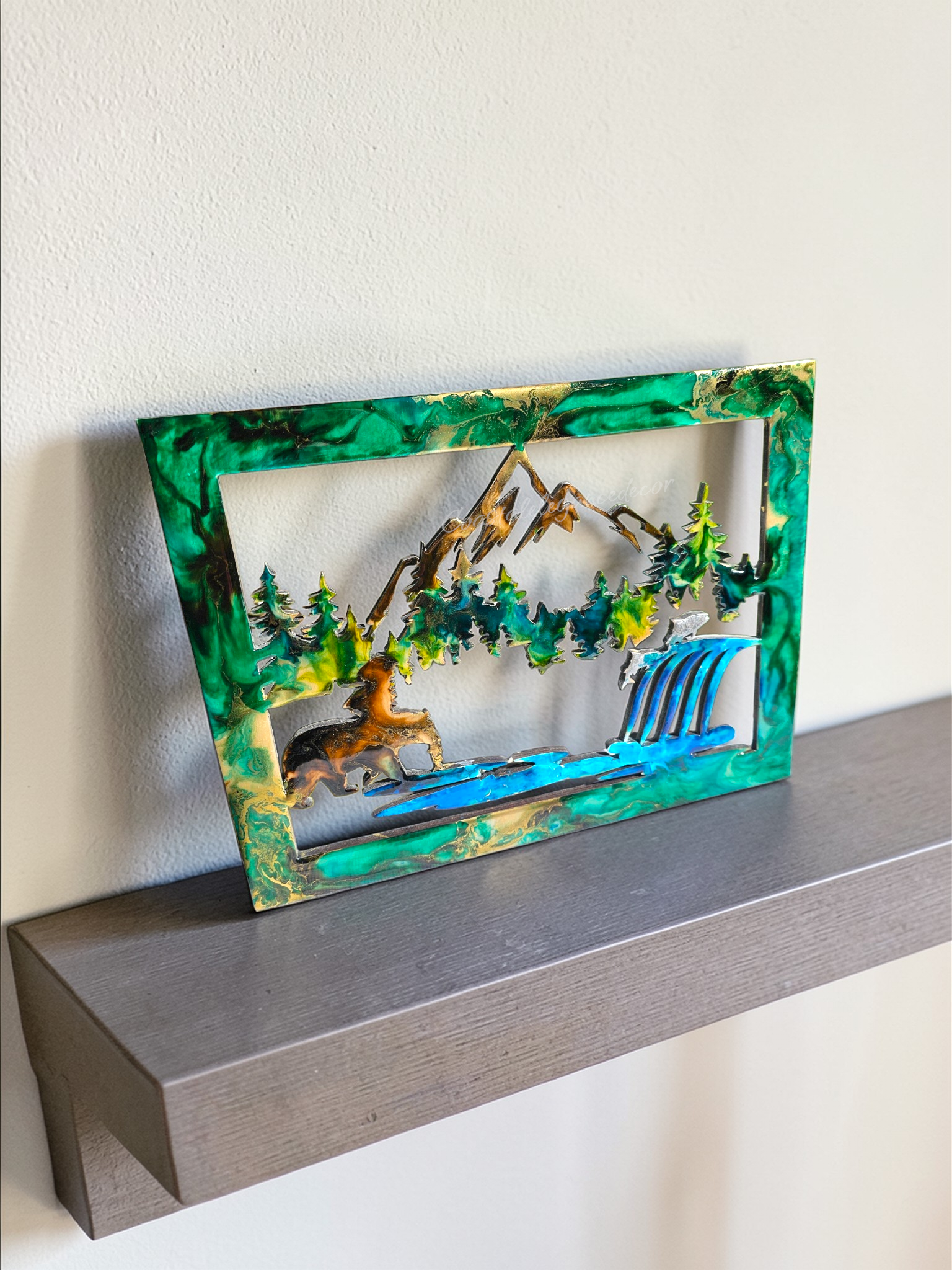 Side view of 14x12 inch resin mountain and bear art showing the 1/4 inch thickness and glossy finish on a wooden base.