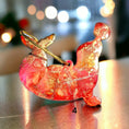Load image into Gallery viewer, Back view of a handcrafted playful seal ornament with handmade resin on wood, featuring metallic cord for hanging.
