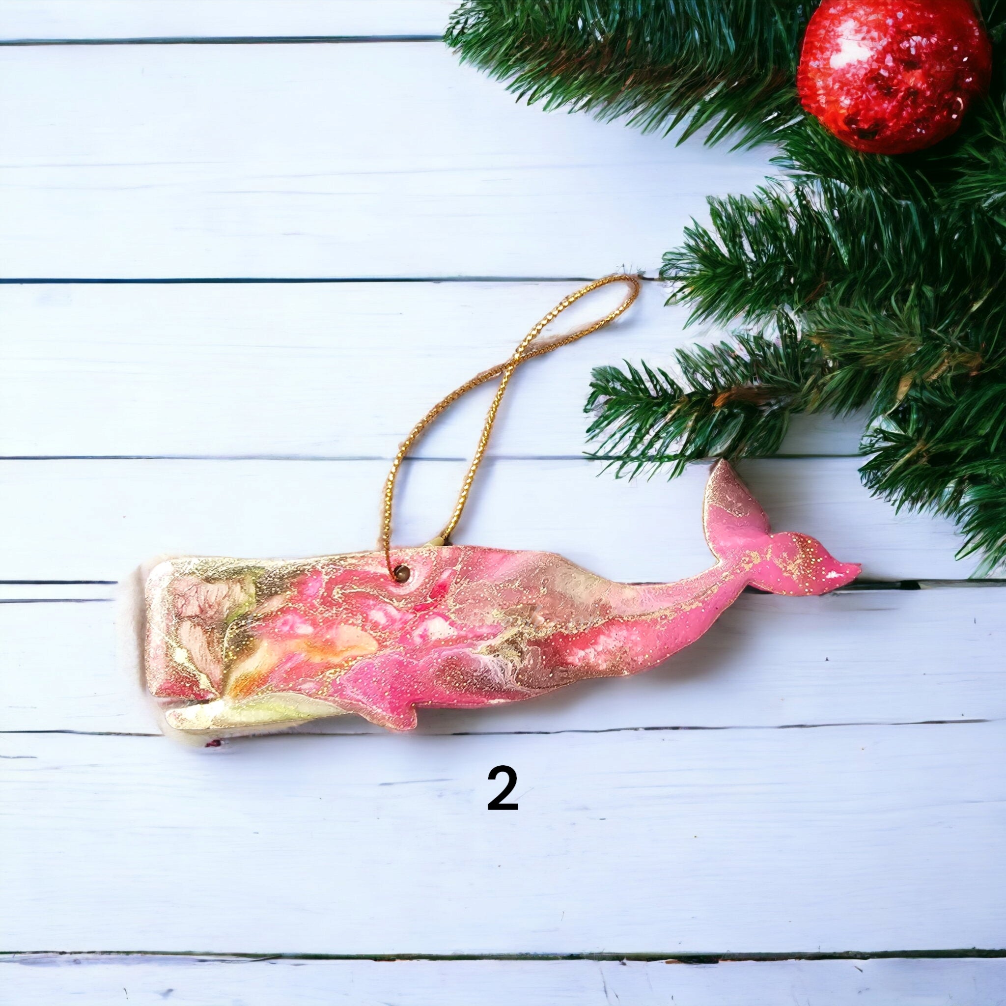 Handcrafted Ocean Sperm Whale Christmas Ornament featuring vibrant colors in resin and wood, measuring 5" x 2", ideal for festive coastal decor.