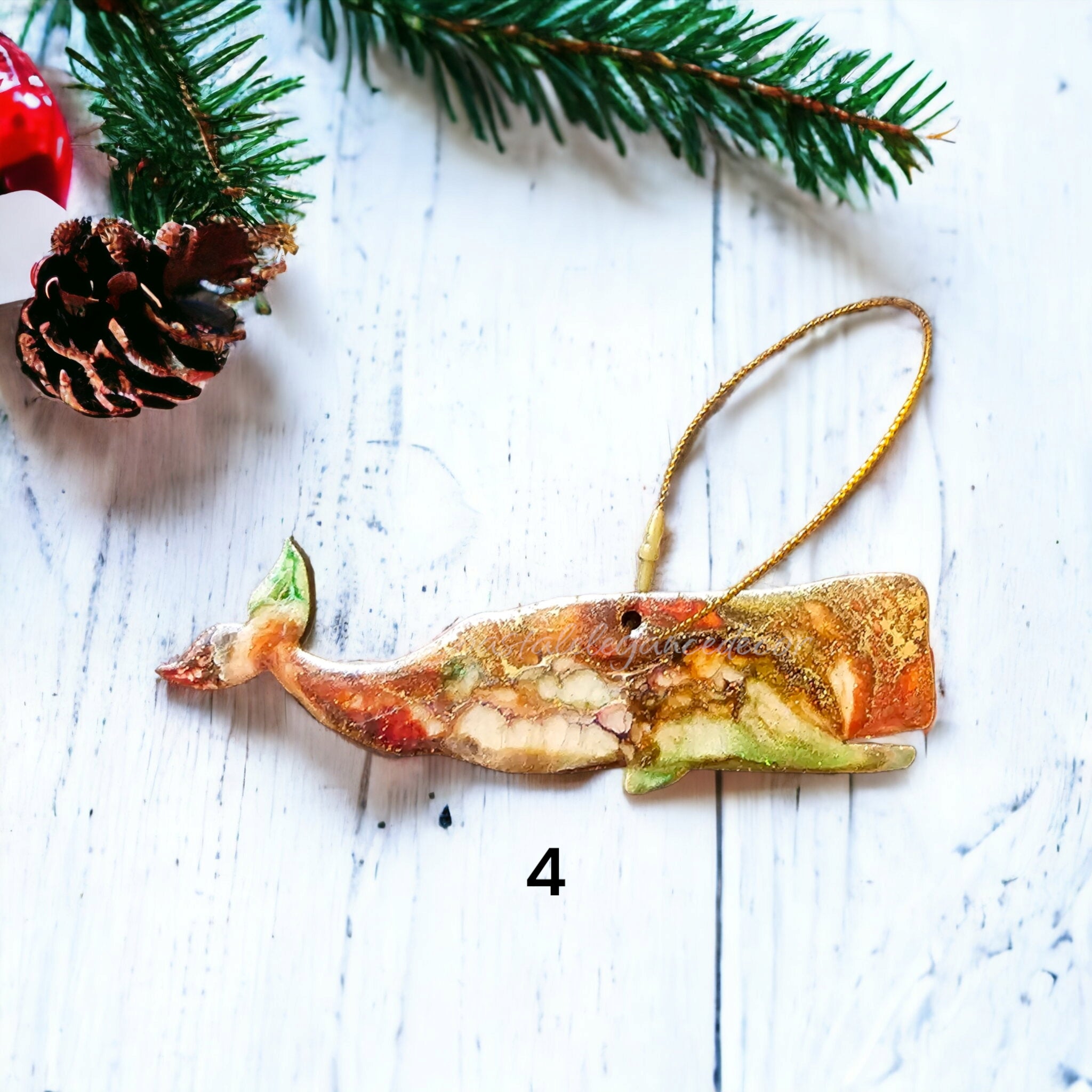 Vibrant handcrafted Ocean Sperm Whale Christmas Ornament - Colorful Resin & Wood Decor, 5" x 2" featuring glitter accents, ideal for festive ocean-themed decorations.