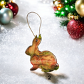 Load image into Gallery viewer, Festive Woodlands Rabbit Christmas Ornaments, colorful resin overlay and glitter, from Coastal Elegance Decor, perfect for holiday decor.
