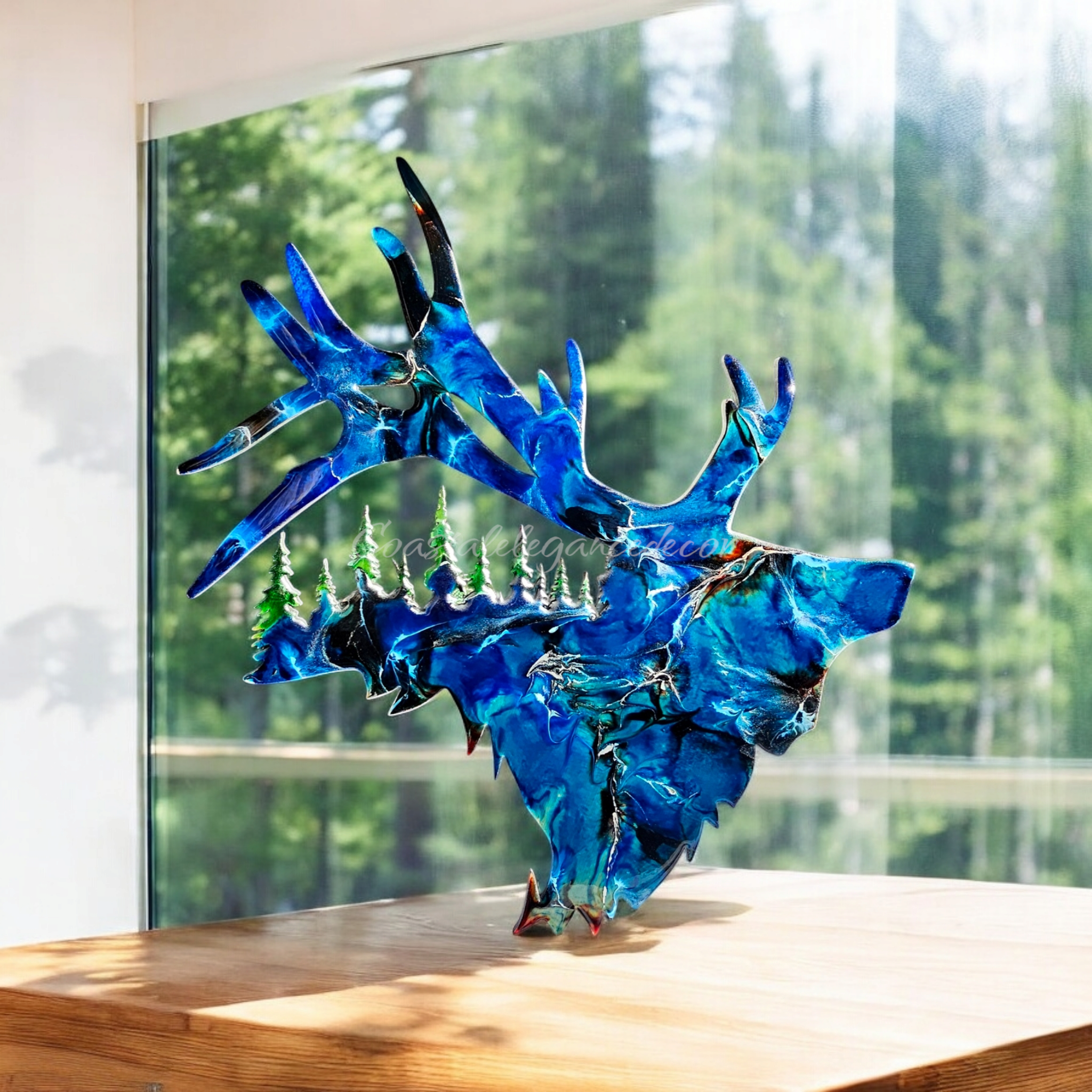 Unique wall art featuring handmade resin on wood elk with detailed tree cutouts, ideal for indoor use.