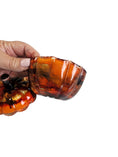 Charger l'image dans la visionneuse de la galerie, Coastal Elegance Decor handcrafted glass pumpkin dish with amber and orange ink swirls, held to show the open lid.
