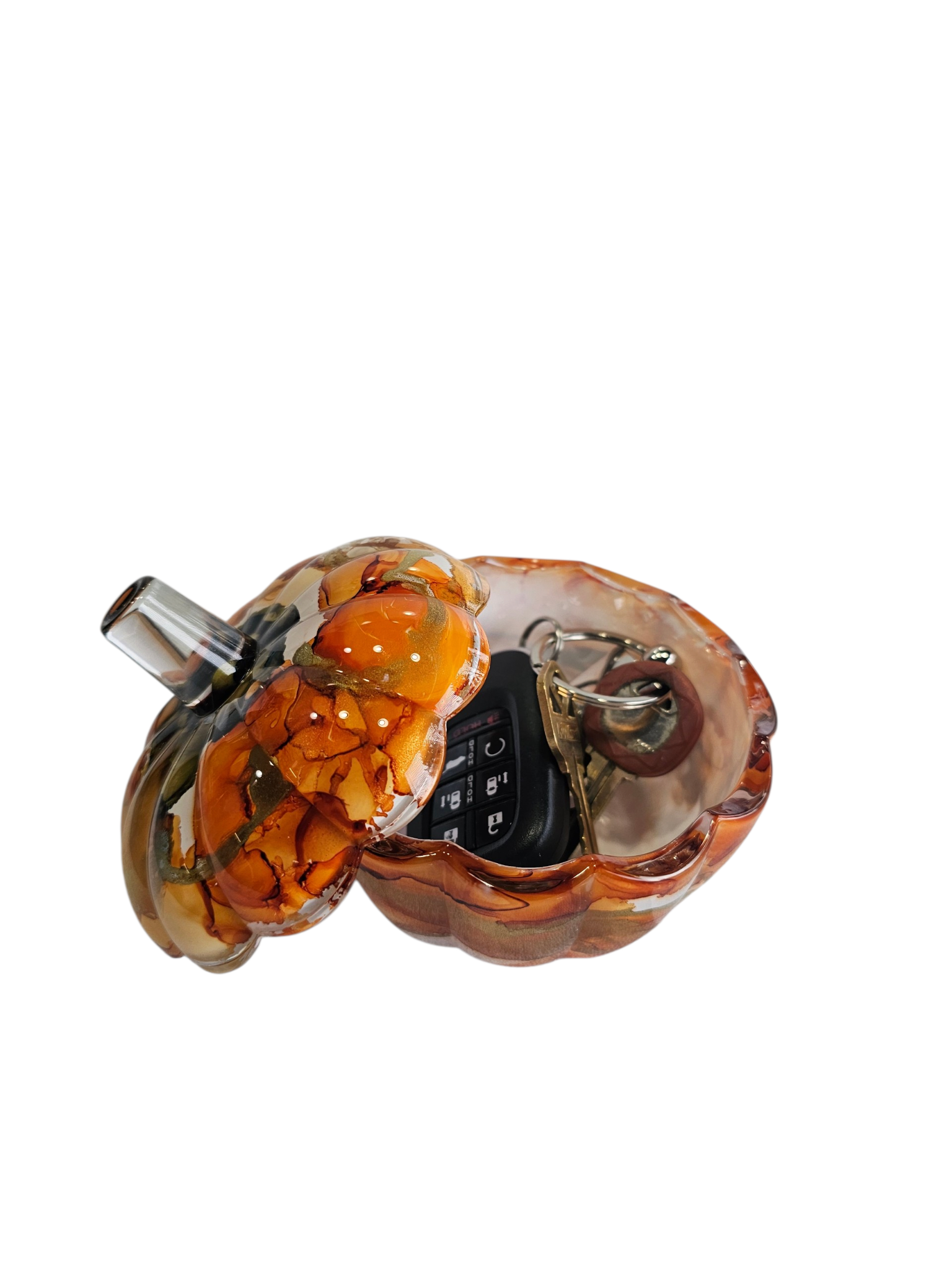 Coastal Elegance Decor handcrafted glass pumpkin dish with amber and orange ink swirls, holding keys on a white background